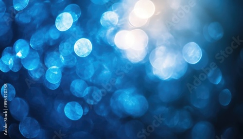 Blue abstract background featuring soft bokeh lights perfect for graphic design projects