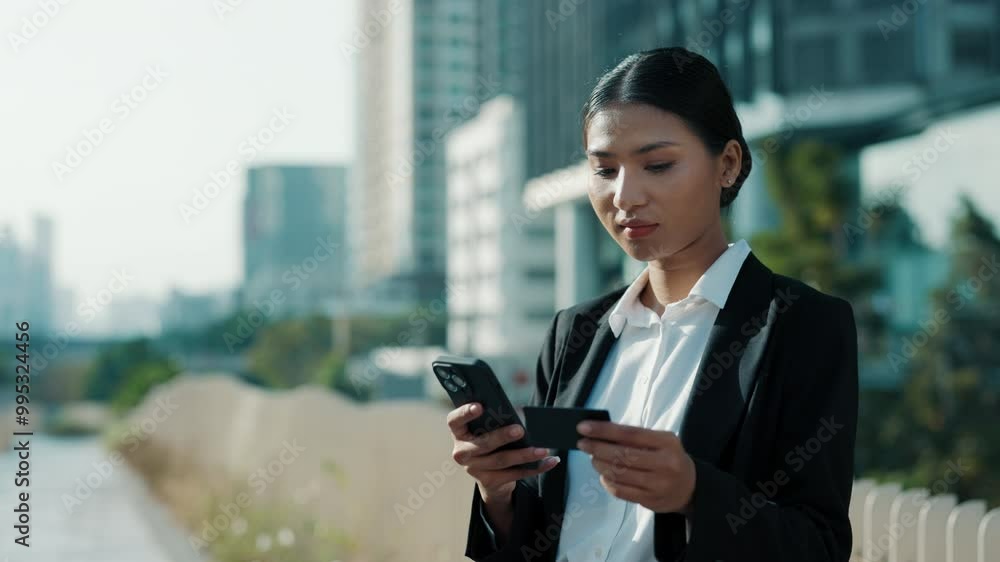Pretty Busy Asian Girl Online Things an Online Shop Through a Cell Phone. Pretty Busy Asian Girl Online Things an Online Shop Through a Cell Phone.