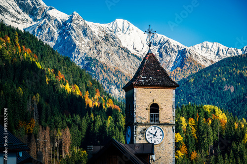 Autumn light on the Carnic Alps. Monte Coglians, Forni Avoltri and its colorful woods