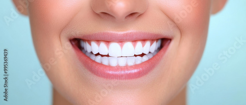 A woman with a bright smile showing off her teeth photo