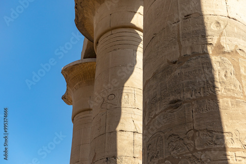 Discover the enchanting forest of papyriform columns that grace the Temple of Luxor. These unique columns, shaped like papyrus reeds, were a sacred symbol in ancient Egypt. photo