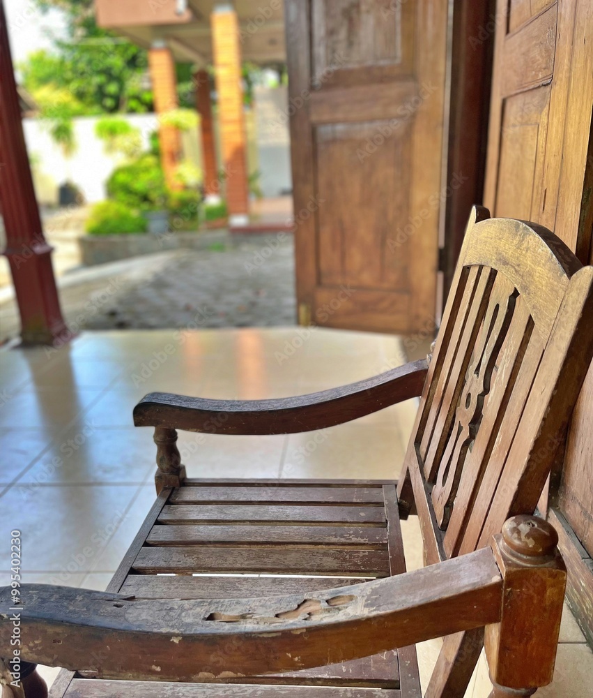 a view from the side of old wooden chairs a view from the side of old wooden chairs