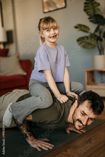 Father and daughter spending time together and enjoying home workout