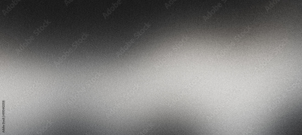 Grainy textured abstract background featuring a smooth gradient from black to gray Grainy textured abstract background featuring a smooth gradient from black to gray
