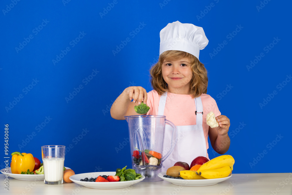 Child chef dressed cook baker apron and chef hat hold broccoli isolated on studio background. Healthy nutrition kids food. Child chef dressed cook baker apron and chef hat hold broccoli isolated on studio background. Healthy nutrition kids food.