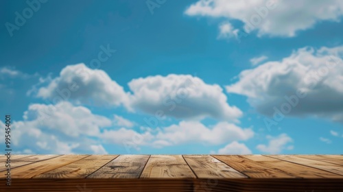 Obscured picture wooden table and abstraction of azure sky in backdrop