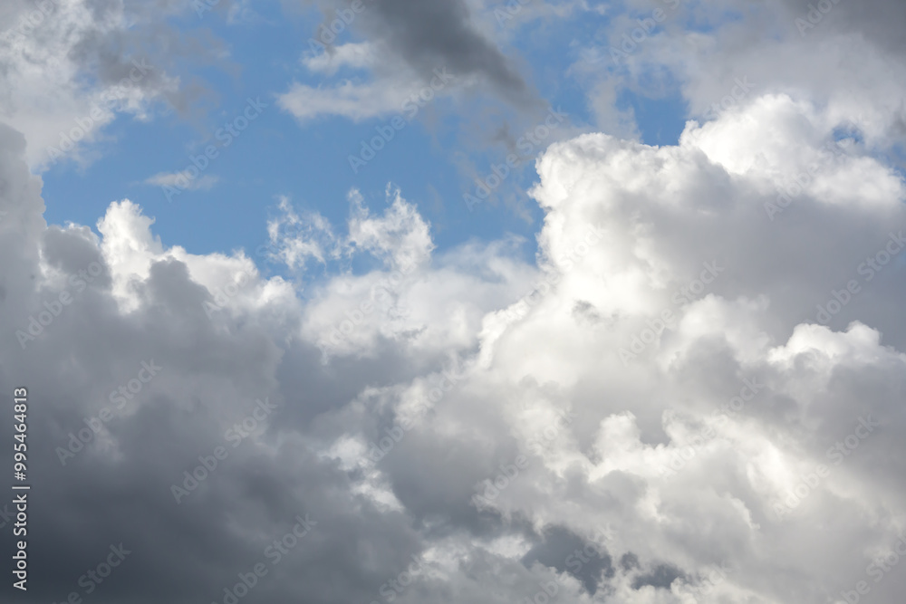 Dramatic cloudy sky with vibrant blue background perfect for nature-themed wallpaper or atmospheric backdrop Dramatic cloudy sky with vibrant blue background perfect for nature-themed wallpaper or atmospheric backdrop