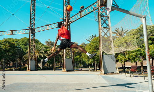 Young basketball players training at the court.