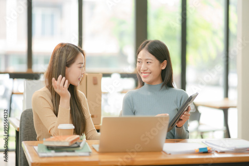 Asian businessman sitting and talking, working at the office