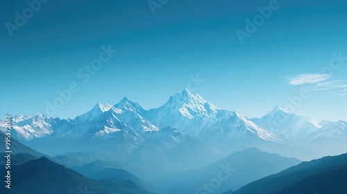 Majestic mountain range under a clear blue sky, with wide open space for text in the foreground.