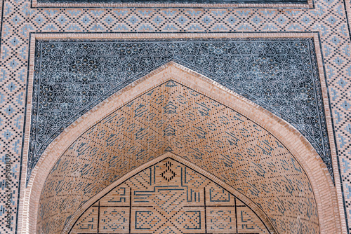 Decorated arch of Miri Arab madrasah entrance in Bukhara. Tilework Uzbekistan showcasing Islamic architecture and design