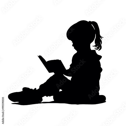 Silhouette of a young person reading a book