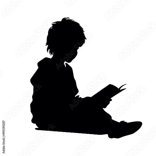 Silhouette of a young person reading a book