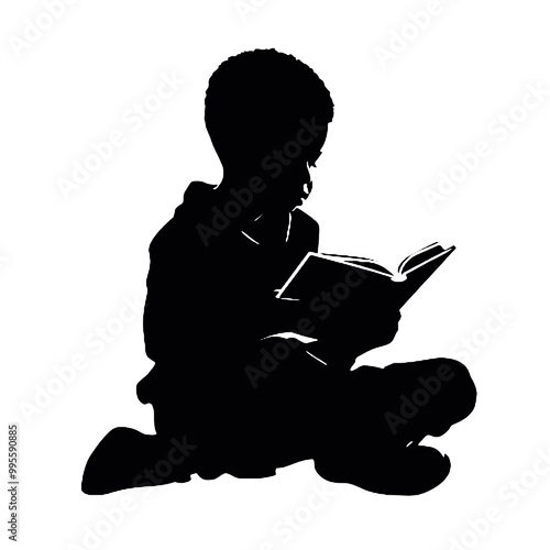 Silhouette of a young person reading a book