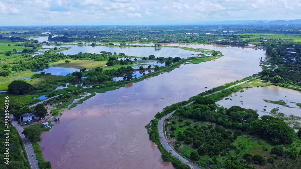 Drone aerial view of heavy flooding in local river after heavy rains. Climate change. Drone aerial view of heavy flooding in local river after heavy rains. Climate change.