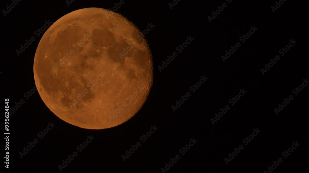 Moon supermoon in the September night sky seen from The Netherlands during a hazy evening. Moon supermoon in the September night sky seen from The Netherlands during a hazy evening.