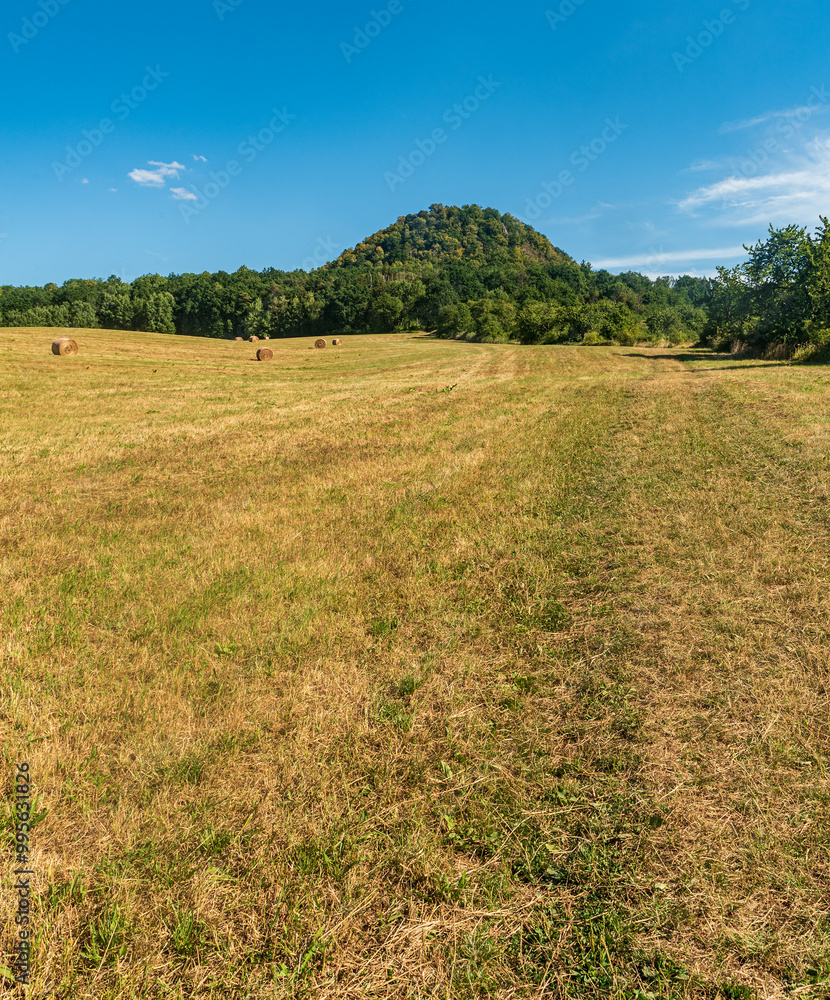 Ronov hill from meadow above Kravare and Blizevedly villages in Czech republic Ronov hill from meadow above Kravare and Blizevedly villages in Czech republic