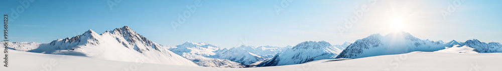 A sweeping panoramic view of a snow-covered mountain range, with jagged peaks piercing through the cloudless sky. The snow glistens under the midday sun, casting long shadows across the slopes. The A sweeping panoramic view of a snow-covered mountain range, with jagged peaks piercing through the cloudless sky. The snow glistens under the midday sun, casting long shadows across the slopes. The