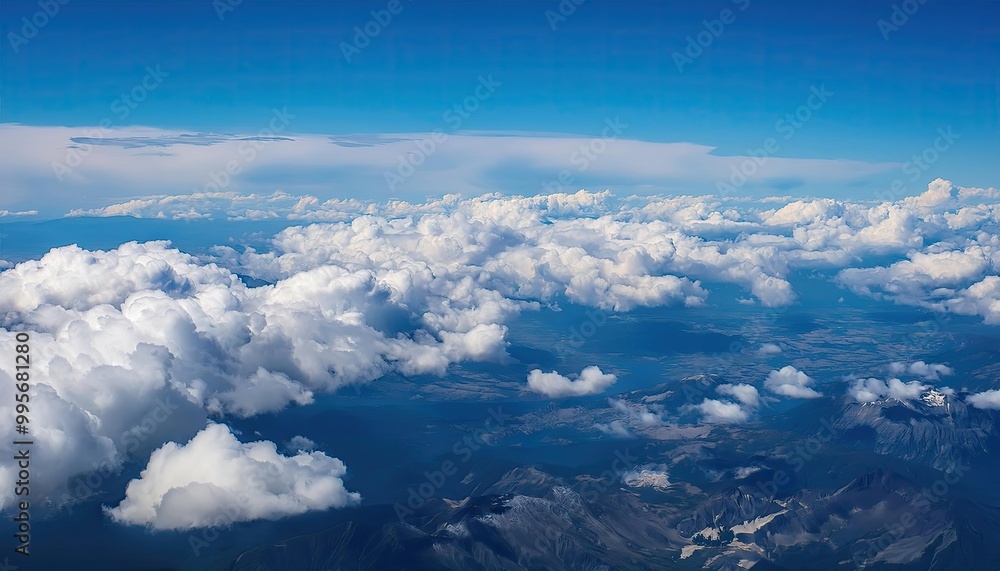 bright cloudy sky view from airplane. White clouds on blue sky background close up, cumulus clouds high in azure skies, beautiful aerial cloudscape view from above. bright cloudy sky view from airplane. White clouds on blue sky background close up, cumulus clouds high in azure skies, beautiful aerial cloudscape view from above.