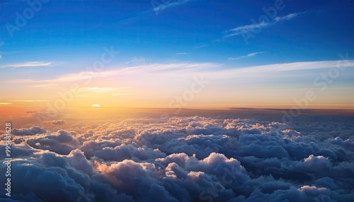 flight over the clouds. view of the clouds from the airplane window. sunset orange clouds at sunset