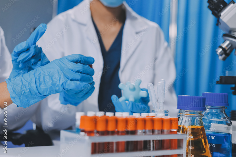 Scientist using microscope in laboratory. Close-up of a researcher's hands adjusting a modern microscope in a lab setting. Science concept Scientist using microscope in laboratory. Close-up of a researcher's hands adjusting a modern microscope in a lab setting. Science concept