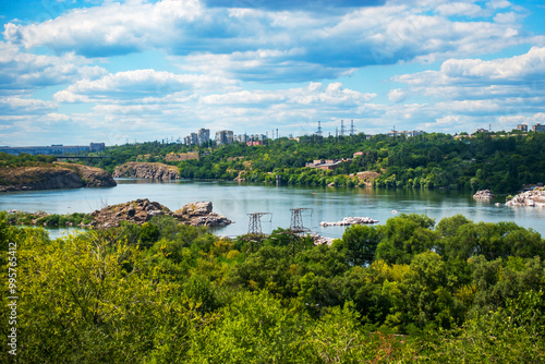 The Dnieper River flows through rocky terrain near the Zaporizhzhya hydroelectric power station in Ukraine photo