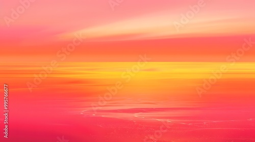 Abstract sunset sky in hues of pink, orange and yellow.