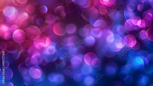 Abstract background with blurred pink and blue circles on a dark background.