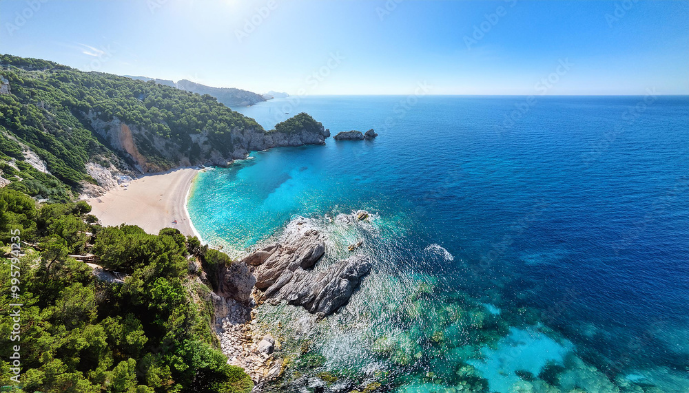 Naklejka premium Aerial view of vibrant turquoise waters nestled between steep rocky cliffs, greenery and sandy beach