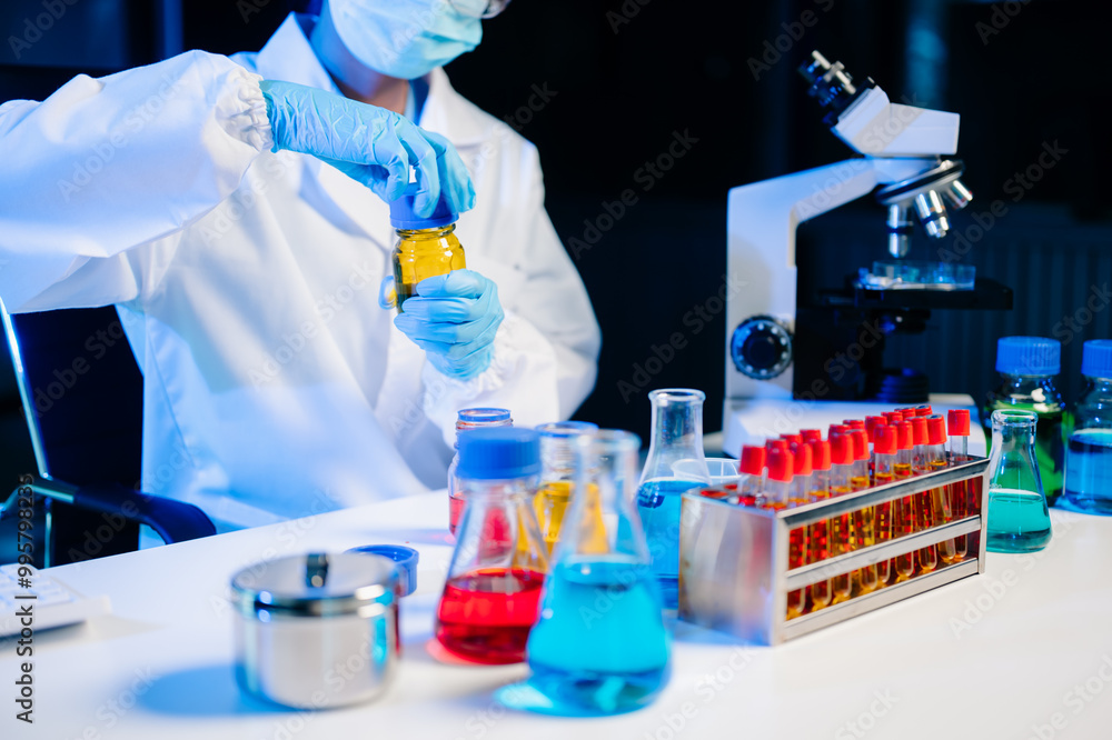 Fototapeta premium Biologist taking experiment with plants working in laboratory..