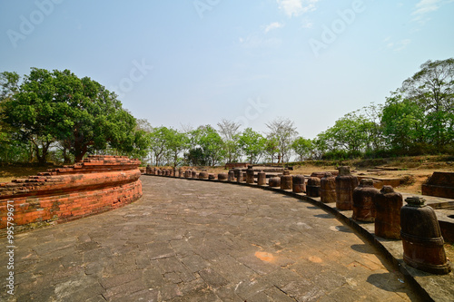 Ruins of Chaityagriha surrounded by small stone stupas called as Votive stupas at Lalitgiri Buddhist Archaeological Site, Odisha, India. photo