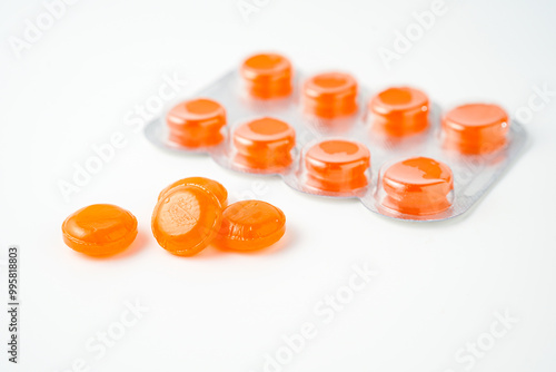 tablets lozenges in a blister pack for coughing in the throat white background