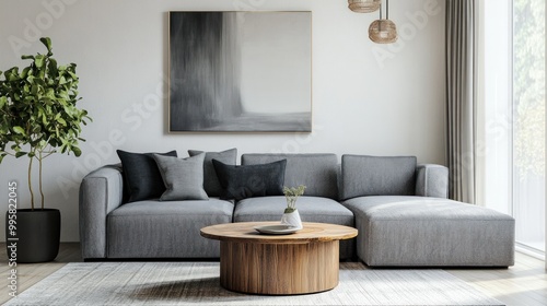 Modern living room featuring a gray sofa, wooden coffee table, and indoor plant for a cozy, contemporary vibe.