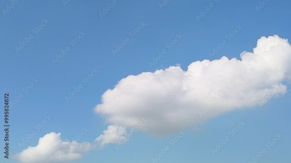Scenic time-lapse of white giant fluffy clouds moving in the blue sky. Natural background, time-lapse, copy space. 4K. Scenic time-lapse of white giant fluffy clouds moving in the blue sky. Natural background, time-lapse, copy space. 4K.