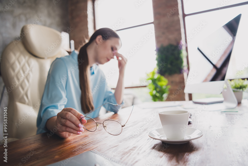 Photo of stressed depressed lady realtor wear shirt eyeglasses feeling headache indoors workplace workshop Photo of stressed depressed lady realtor wear shirt eyeglasses feeling headache indoors workplace workshop
