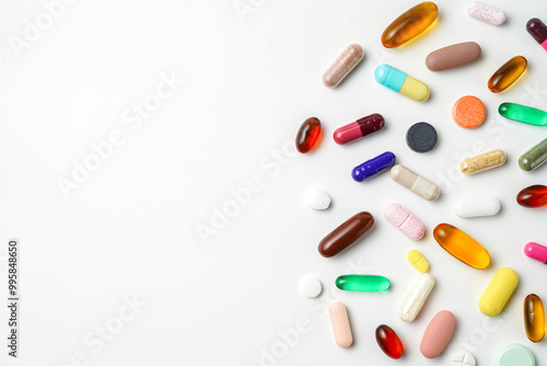 A lot of colorful medication pills capsules tablets softgel supplements, fish oil, vitamin, omega 3