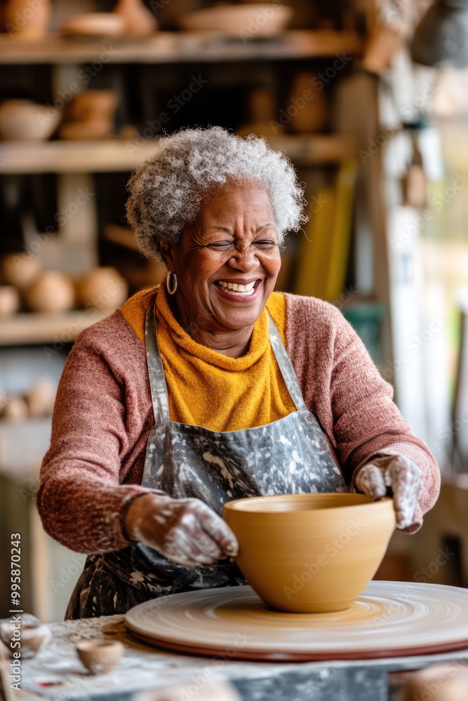 elderly african american female in pottery class, shaping clay on wheel, laughing and smiling, lifestyle. senior activity and hobbies, design for poster elderly african american female in pottery class, shaping clay on wheel, laughing and smiling, lifestyle. senior activity and hobbies, design for poster