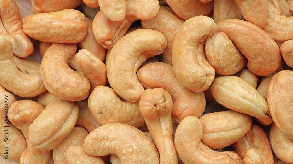 Cashew Pieces on a turntable from overhead. Rotation. Cashew Pieces on a turntable from overhead. Rotation.