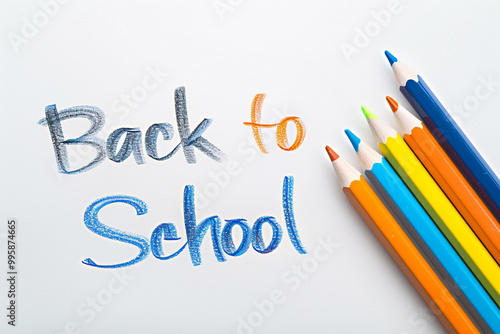 Back to school: colorful pencils and papers scattered on a desk, ready for learning and growth
 photo