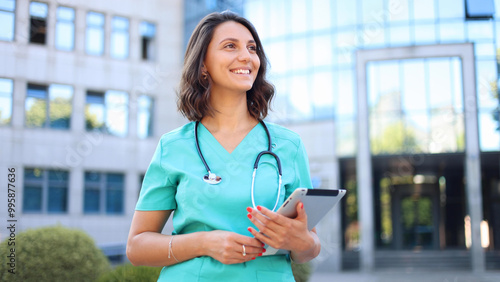 Beautiful, young doctor on a break outside photo