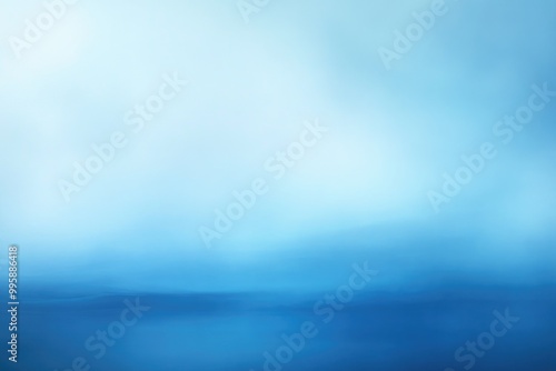 Blurred abstract background featuring a smooth gradient transitioning from blue tones