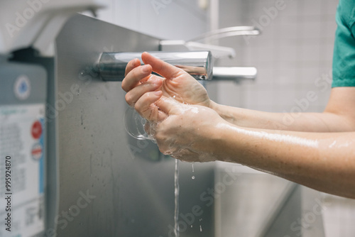 Medical personnel washing their hands after leaving the operating room