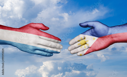 Philippines and Luxembourg country handshaking with flags, consensus concept international co-operation illustration