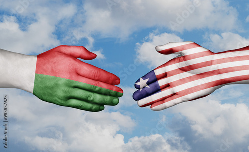 Liberia and Madagascar country handshaking with flags, consensus concept international co-operation illustration