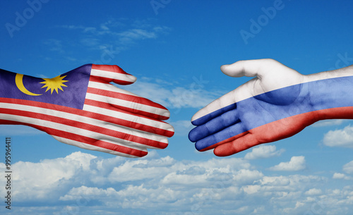 Russian Federation and Malaysia country handshaking with flags, consensus concept international co-operation illustration