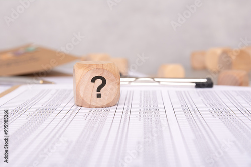 A Question Mark on Financial Documents signals the need for scrutiny and highlights issues photo