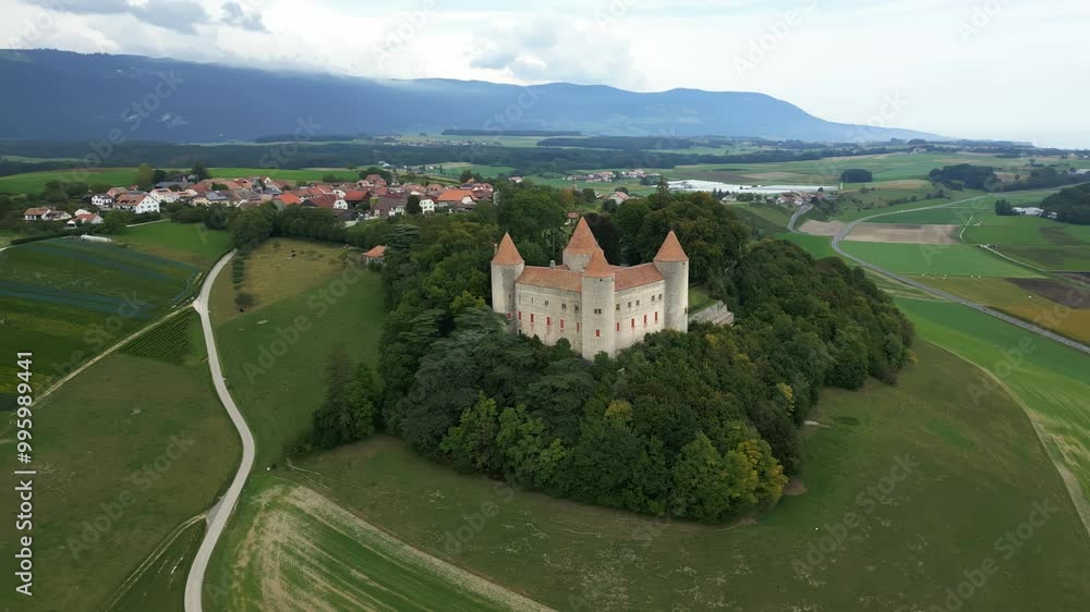 Orbit drone shot close to Champvent Castle in Canton of Vaud in Switzerland. Orbit drone shot close to Champvent Castle in Canton of Vaud in Switzerland.