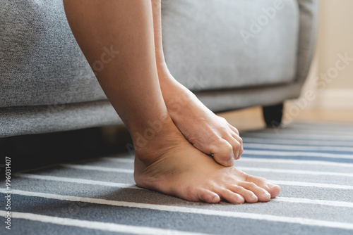 Wallpaper Mural Close-up bare feet of person feeling itchy and irritated try to scratching by toe. Torontodigital.ca