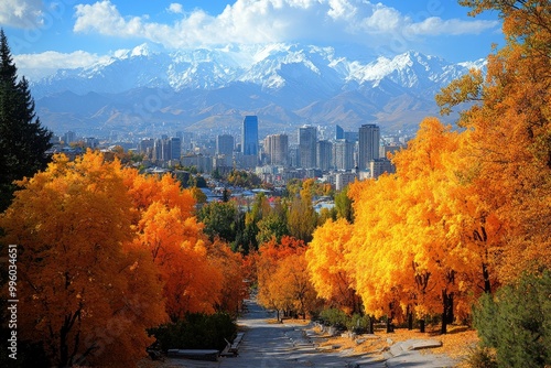 Autumn colors exploding in the city of almaty with tian shan mountains in background photo