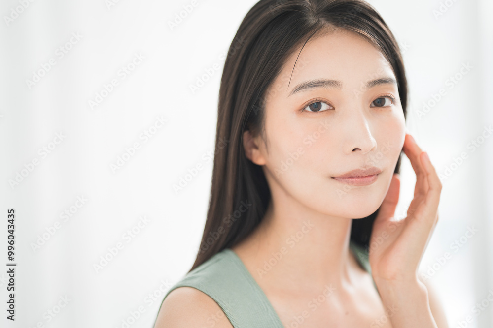 Skin care. Woman with beauty face touching healthy facial skin portrait. Asian woman.
Skin care. Woman with beauty face touching healthy facial skin portrait. Asian woman.